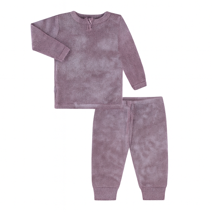 Purple textured pajama set on a white background
