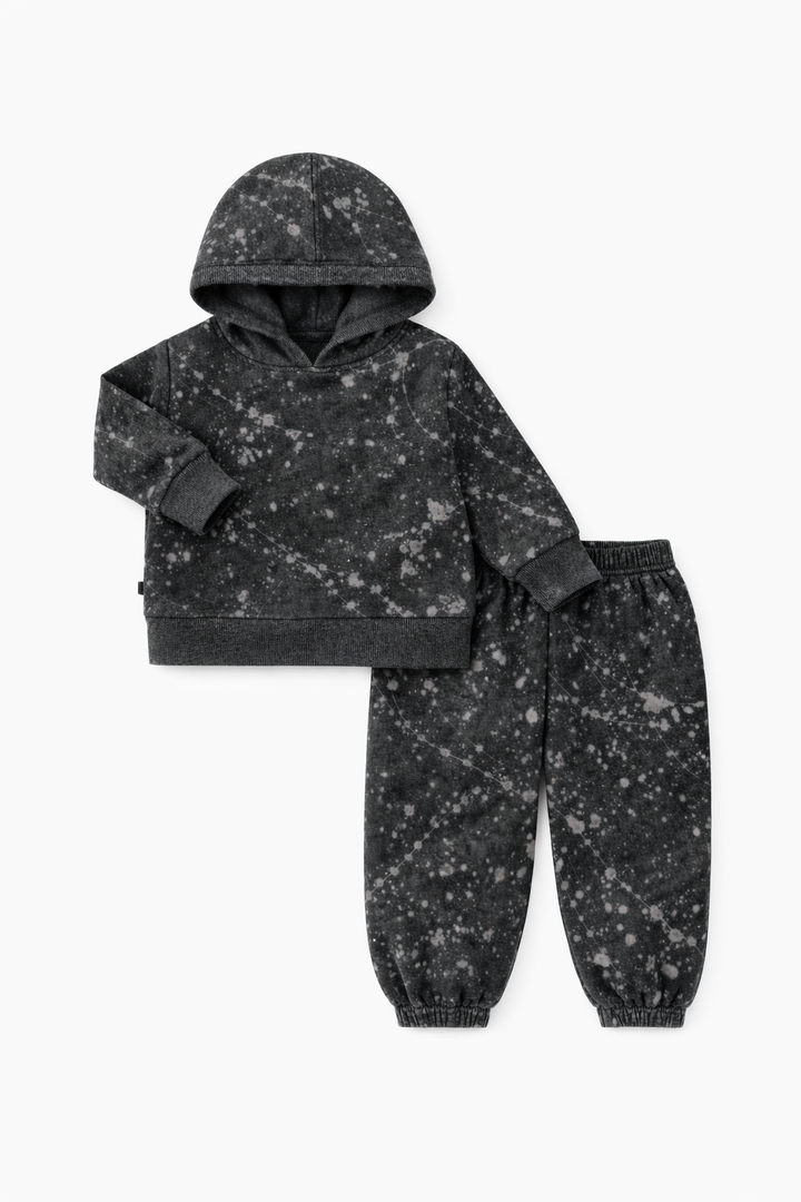 Black and gray splatter-patterned hoodie and pants set on a white background