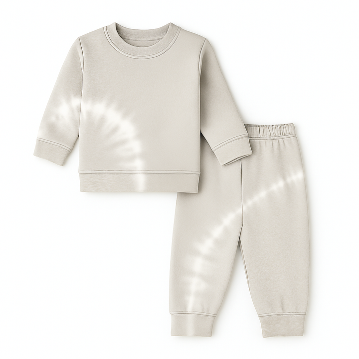 Beige sweatshirt and pants set on a white background