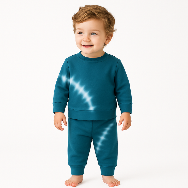 Child wearing a blue tie-dye outfit on a white background