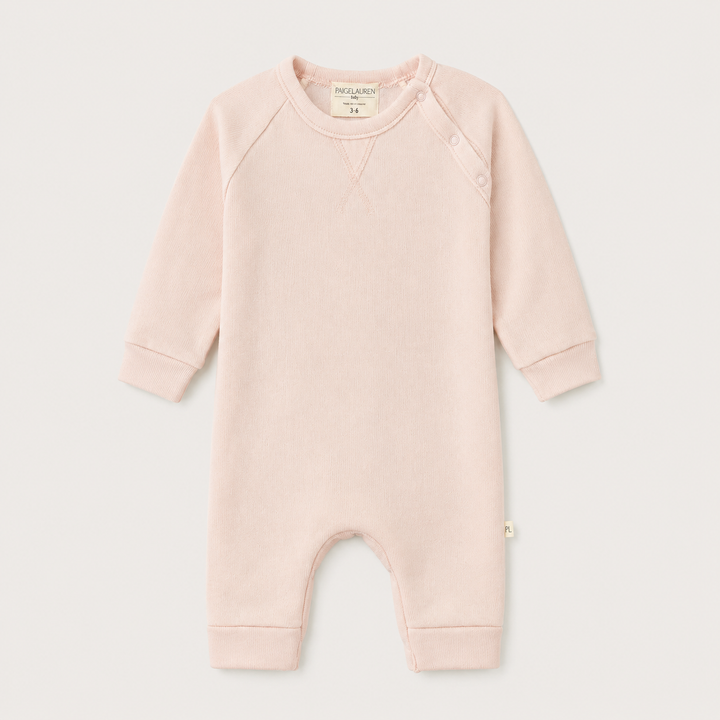 PAIGELAUREN Fleece Sweatshirt Raglan Romper in Light Pink, front product view