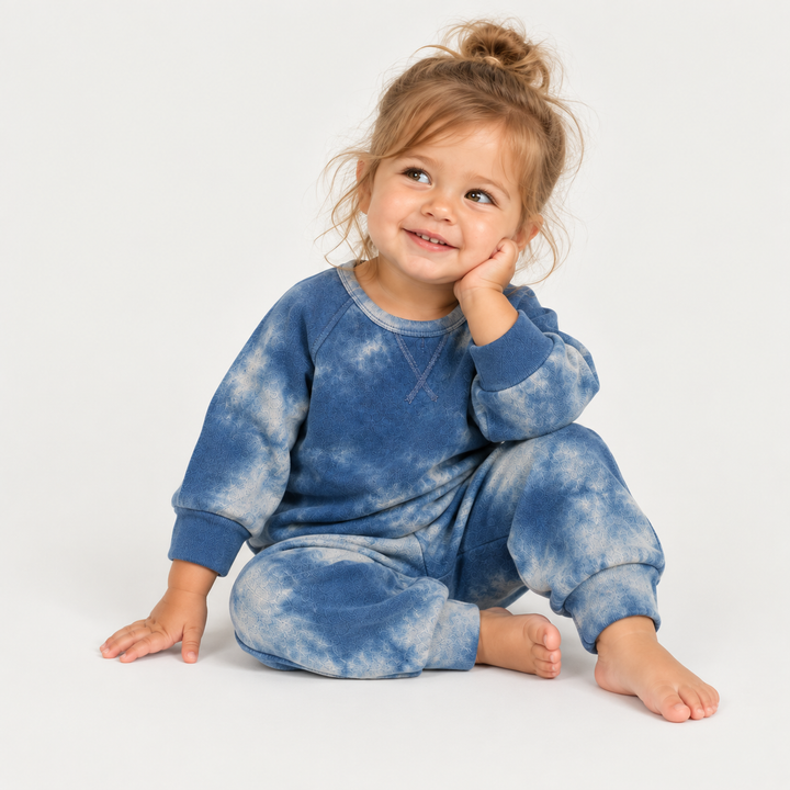 Toddler modeling PAIGELAUREN Blue hand-dyed marble fleece sweatshirt and sweatpant set