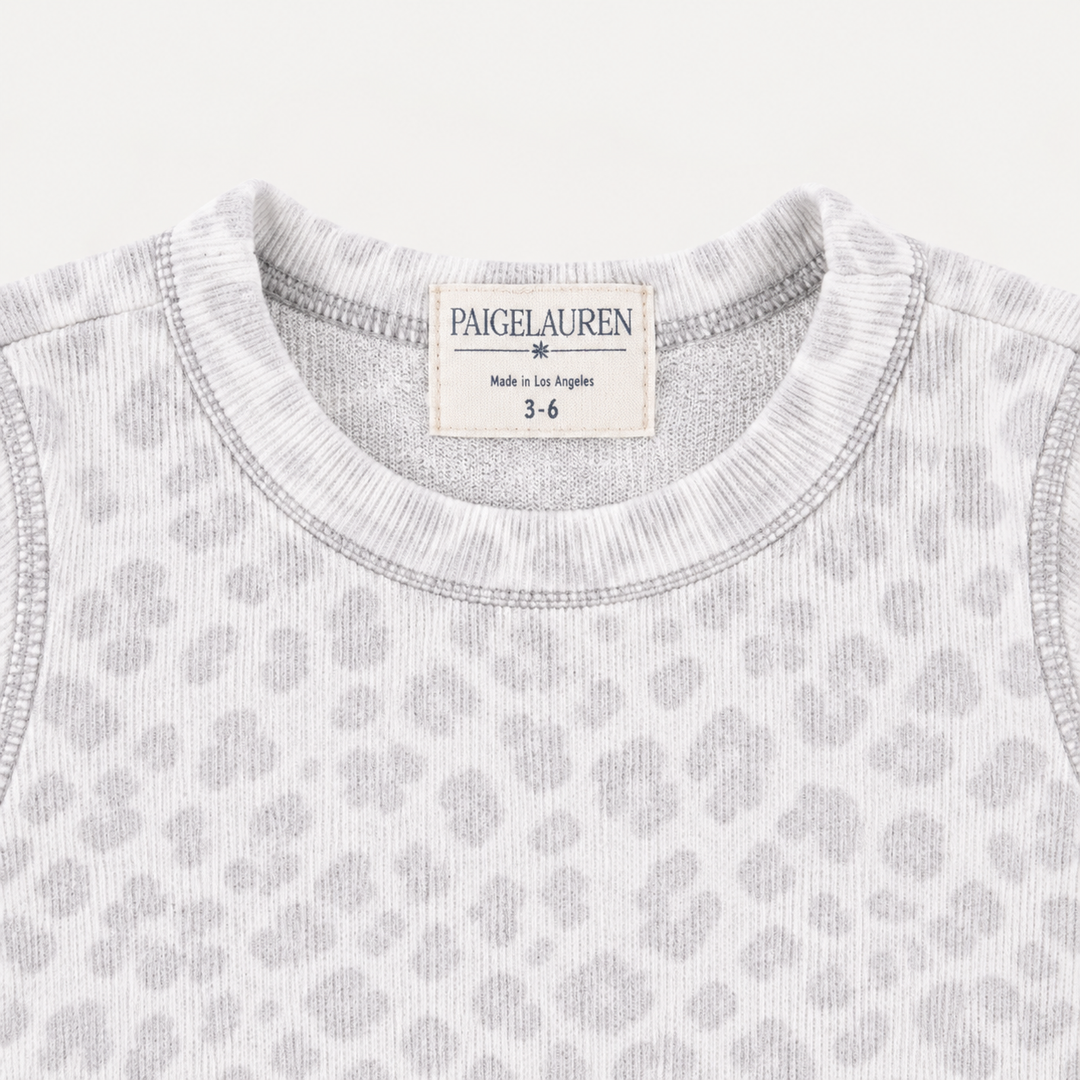 Close-up of PAIGELAUREN Gray and White Brushed Hacci animal print fabric