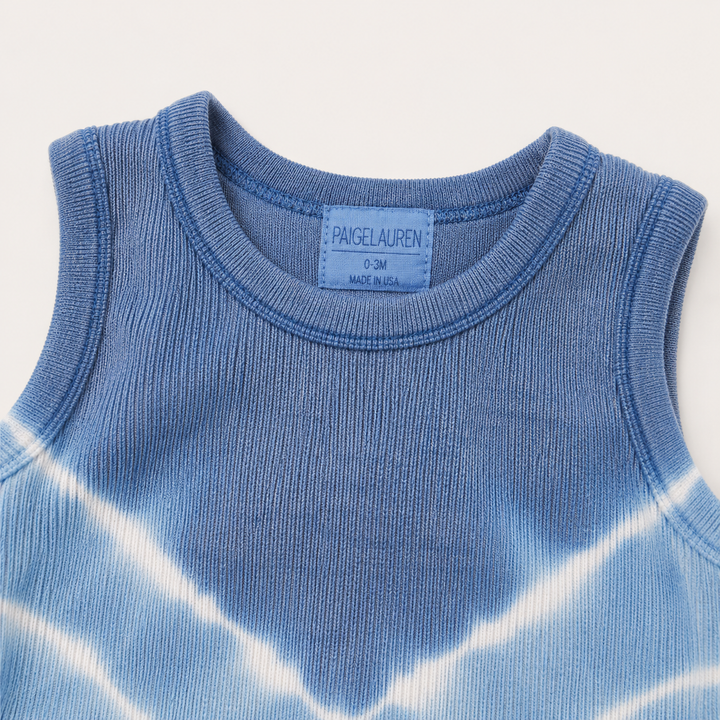 Close-up of the neckline, soft binding, and baby rib texture on the PAIGELAUREN Blue Tie Dye Tank Overall