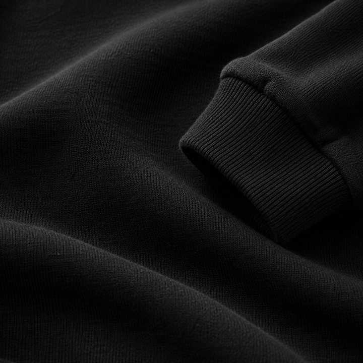 Macro close-up of the ultra-soft brushed fleece fabric in Black