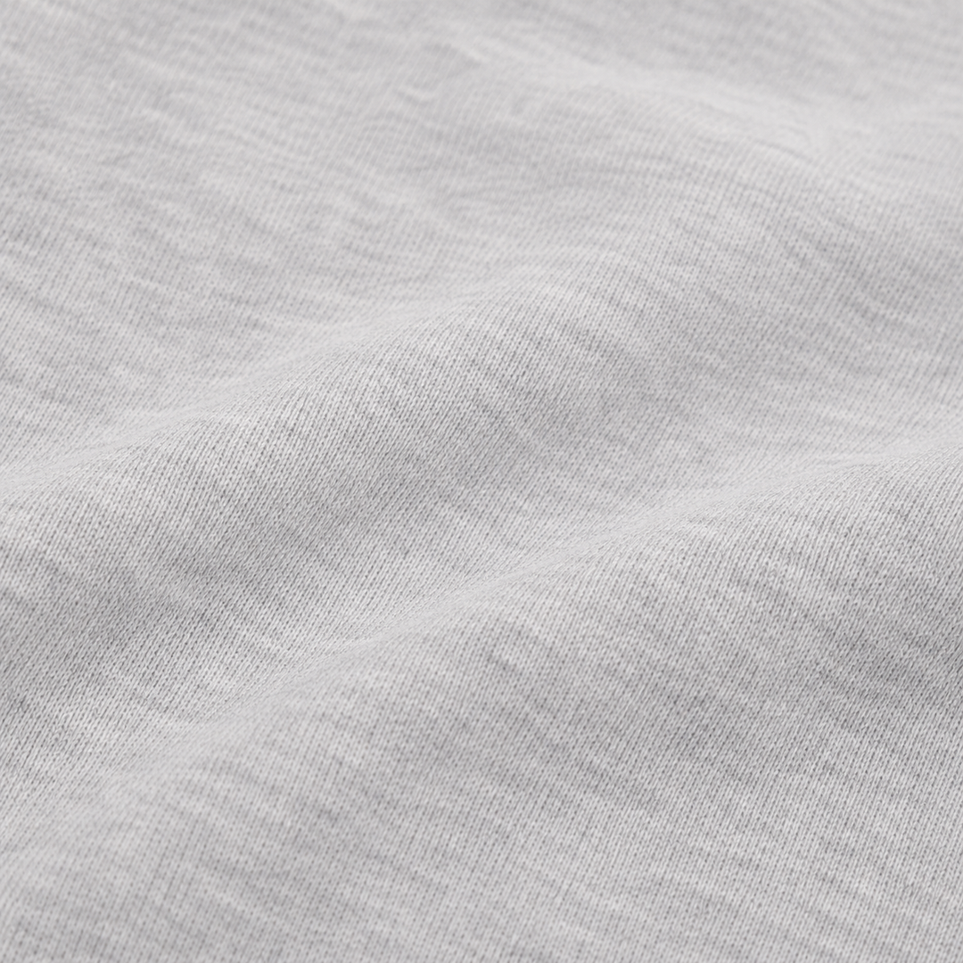 close-up of the ultra-soft brushed fleece fabric on the PAIGELAUREN Fleece Sweatshirt Henley Romper