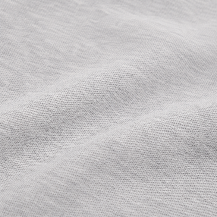 close-up of the ultra-soft brushed fleece fabric on the PAIGELAUREN Fleece Sweatshirt Henley Romper