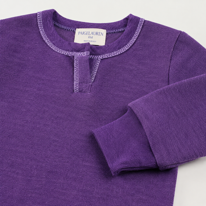 Close-up of the sleeve, rib cuff, and Henley neckline on the PAIGELAUREN Fleece Sweatshirt Henley Romper