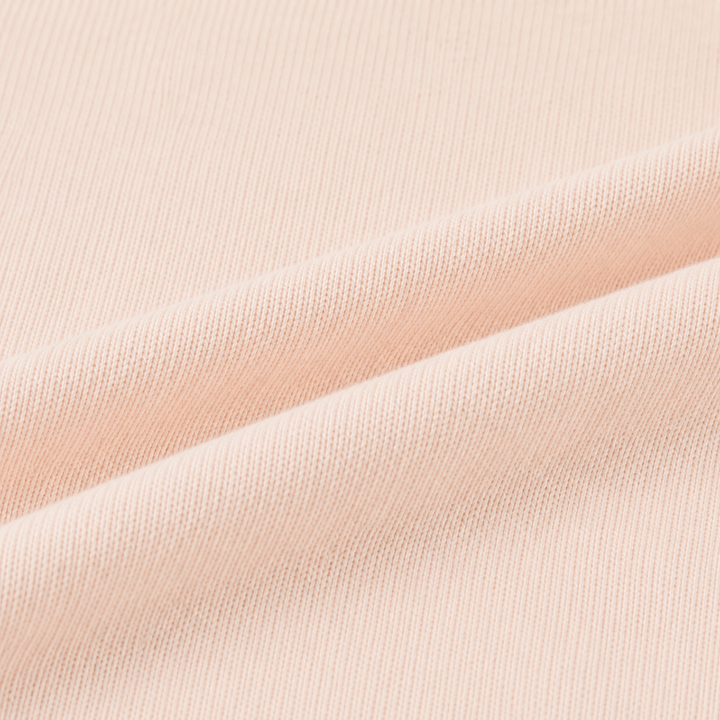 Close-up of the ultra-soft brushed fleece fabric on the PAIGELAUREN Fleece Sweatshirt Raglan Romper