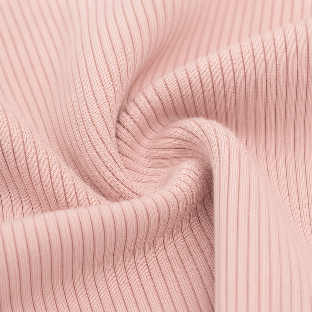 Close-up of the premium 2x1 rib cotton fabric on the PAIGELAUREN Garment Dye Ribbed Shortall Onesie