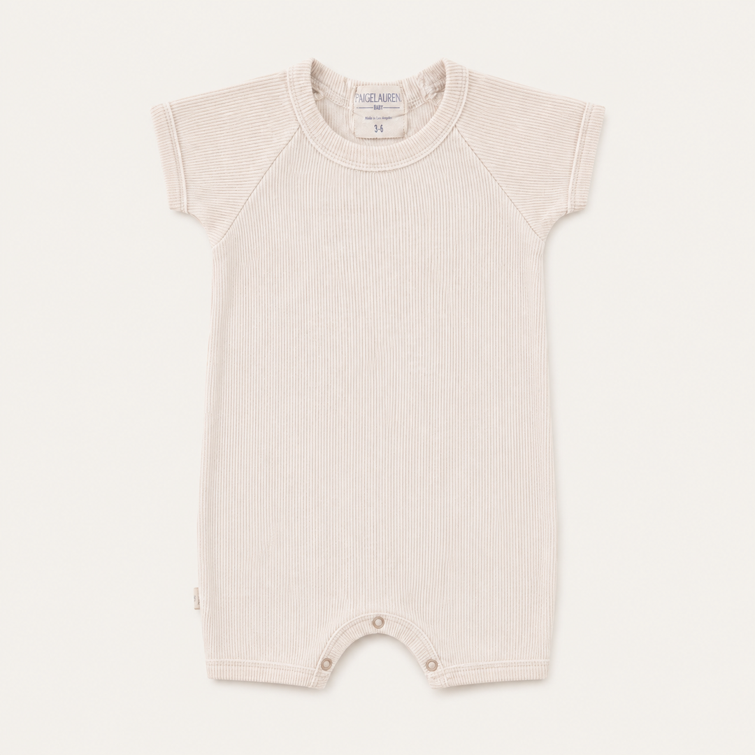 PAIGELAUREN Garment Dye Ribbed Shortall Onesie in premium 2x1 rib cotton, front product view. Beige