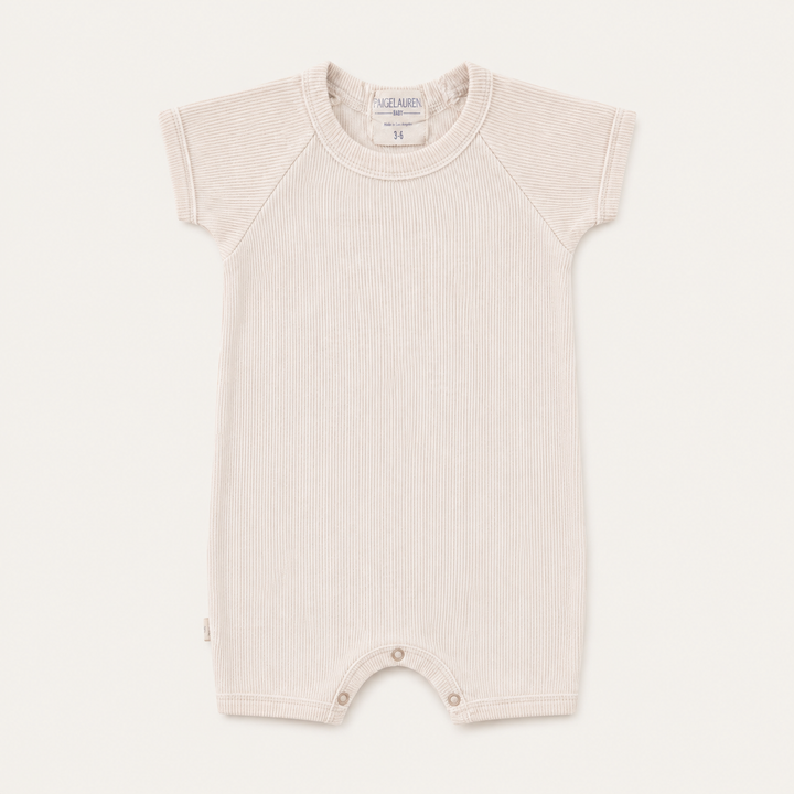 PAIGELAUREN Garment Dye Ribbed Shortall Onesie in premium 2x1 rib cotton, front product view. Beige