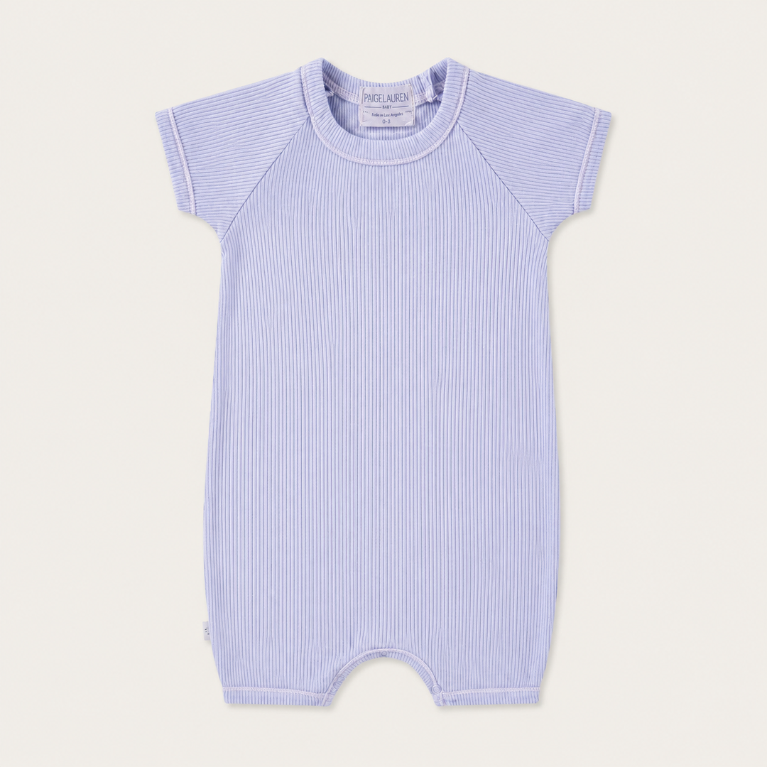 PAIGELAUREN Garment Dye Ribbed Shortall Onesie in premium 2x1 rib cotton, front product view. Lavender