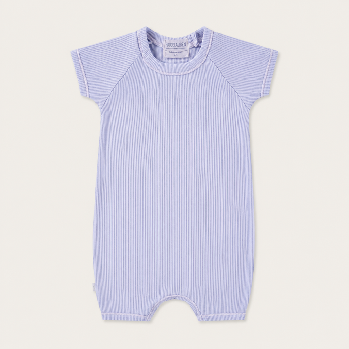 PAIGELAUREN Garment Dye Ribbed Shortall Onesie in premium 2x1 rib cotton, front product view. Lavender