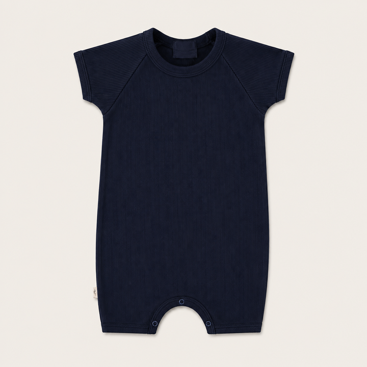 PAIGELAUREN Garment Dye Ribbed Shortall Onesie in premium 2x1 rib cotton, front product view. Navy