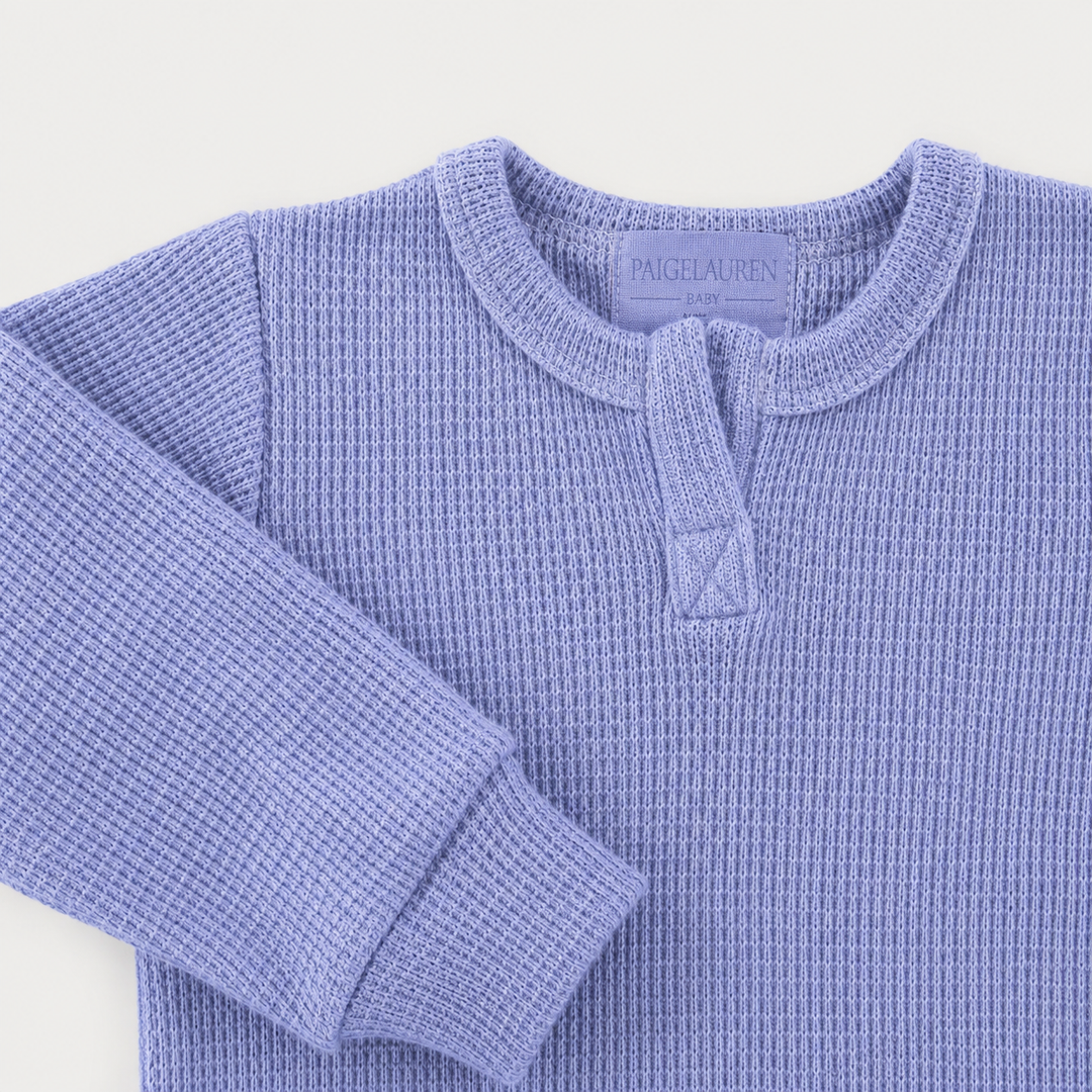 Close-up of Henley neckline and thermal sleeve detail on the PAIGELAUREN Garment Dyed Thermal Romper