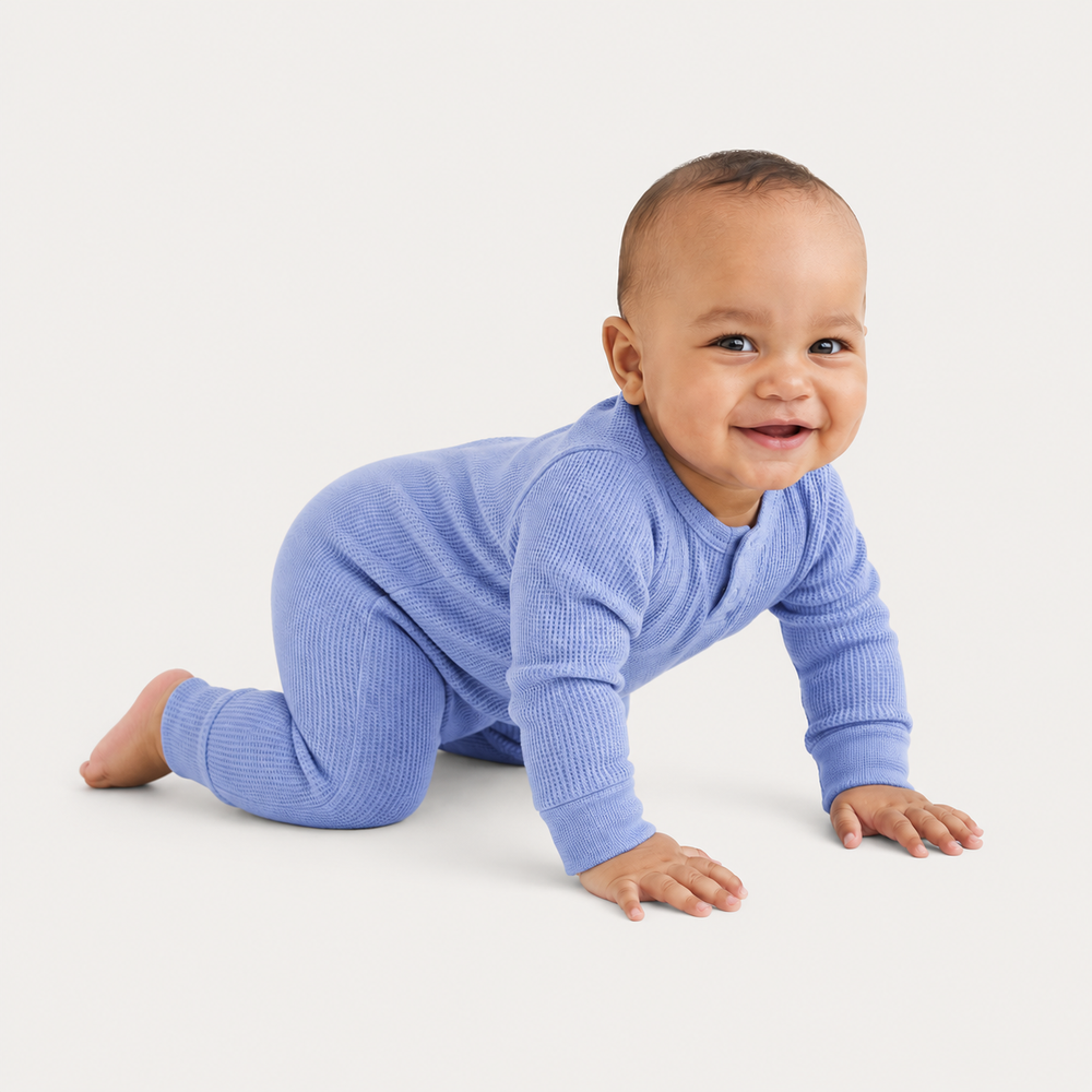 Side view of PAIGELAUREN Garment Dyed Thermal Romper in soft blue thermal fabric