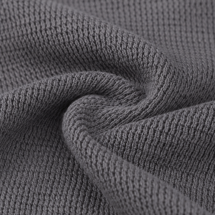 Close-up of soft garment dyed thermal knit fabric in gray showing premium texture