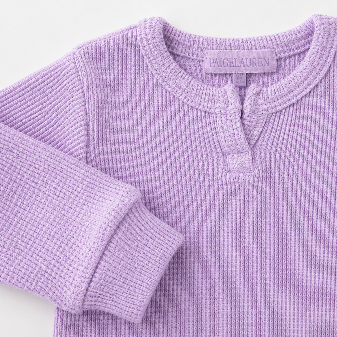 Close-up of Henley neckline and thermal sleeve detail on the PAIGELAUREN Garment Dyed Thermal Romper. Lilac