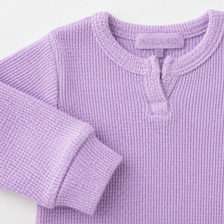 Close-up of Henley neckline and thermal sleeve detail on the PAIGELAUREN Garment Dyed Thermal Romper. Lilac