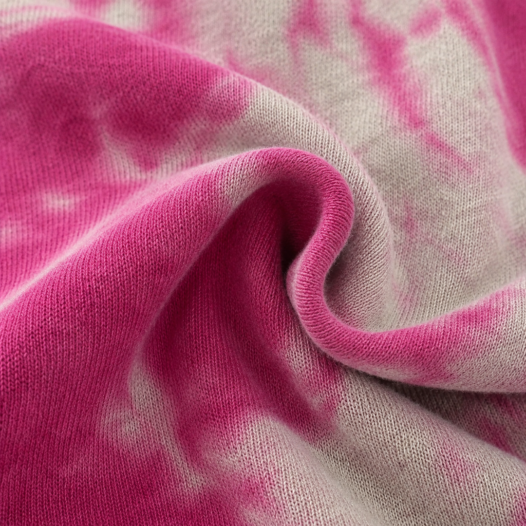 Close-up of the hand-dyed marble fleece fabric on the PAIGELAUREN Heathered Fleece Marble Sweatshirt Romper
