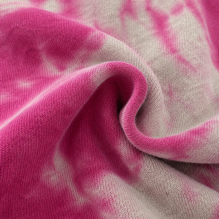 Close-up of the hand-dyed marble fleece fabric on the PAIGELAUREN Heathered Fleece Marble Sweatshirt Romper