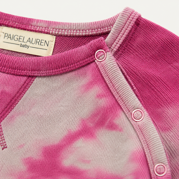 Close-up of the snap inseam and ribbed leg opening on the PAIGELAUREN Heathered Fleece Marble Sweatshirt Romper