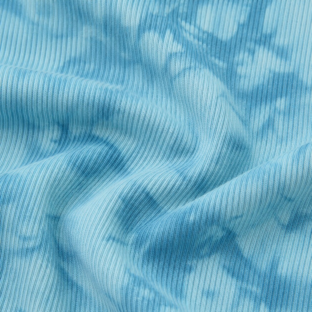 Close-up of PAIGELAUREN Aqua Marble 2x1 Rib fabric and hand-dyed texture