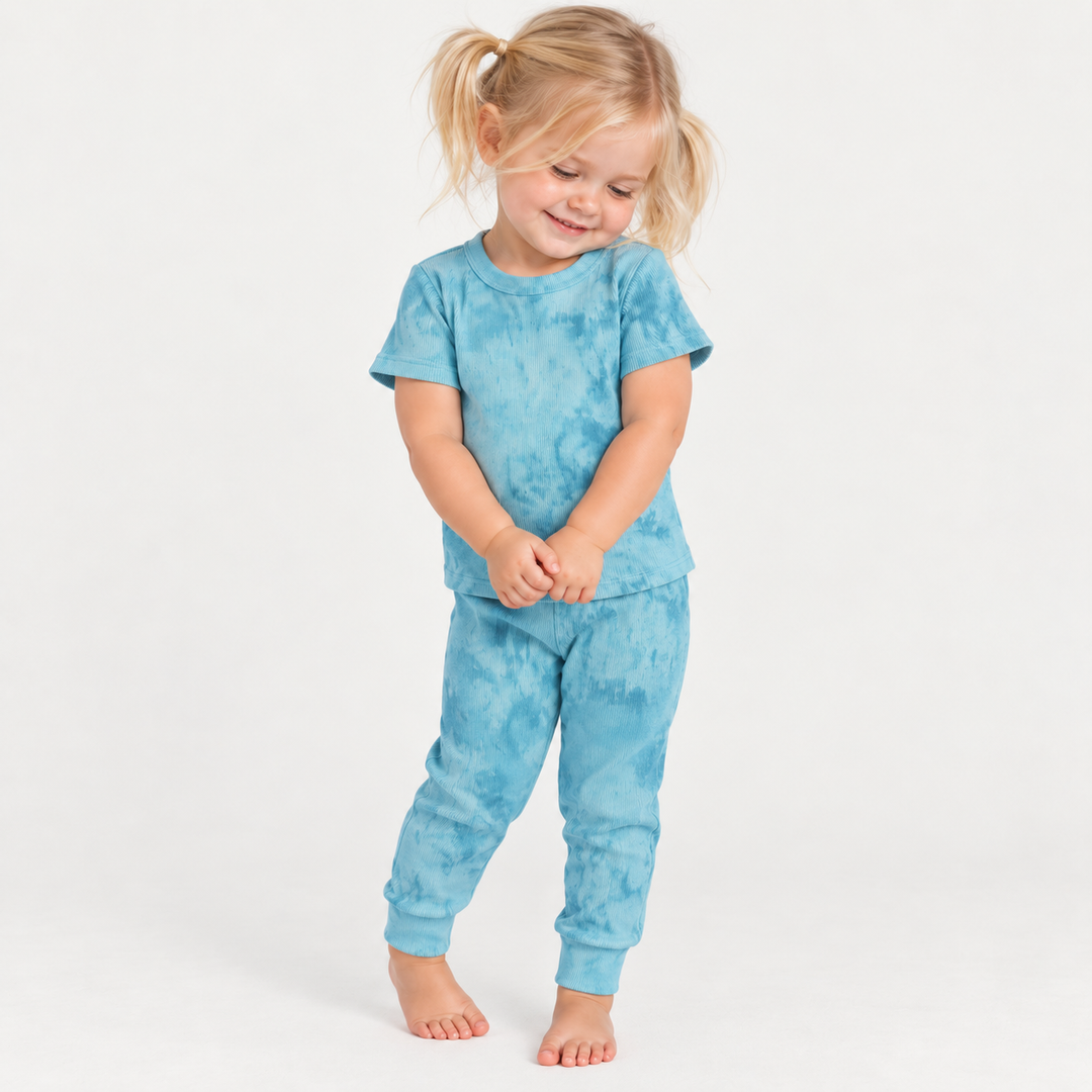 Toddler modeling the PAIGELAUREN Aqua Marble 2x1 Rib Tee + Legging Set