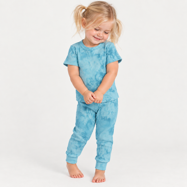 Toddler modeling the PAIGELAUREN Aqua Marble 2x1 Rib Tee + Legging Set