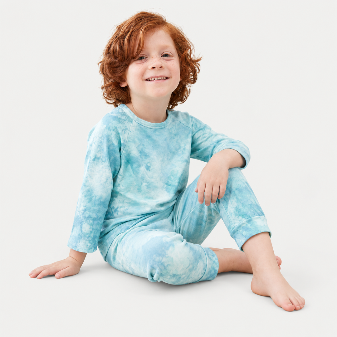 Child wearing PAIGELAUREN aqua marble French terry raglan tee and jogger