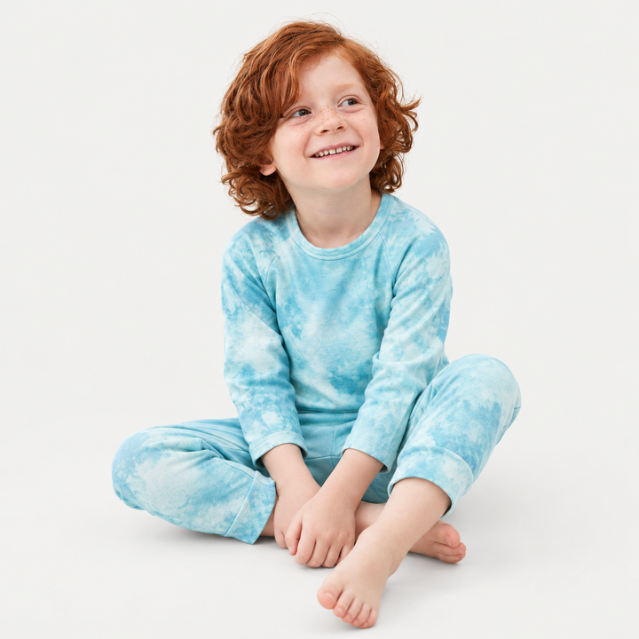 Child in aqua marble French terry tee and jogger set by PAIGELAUREN