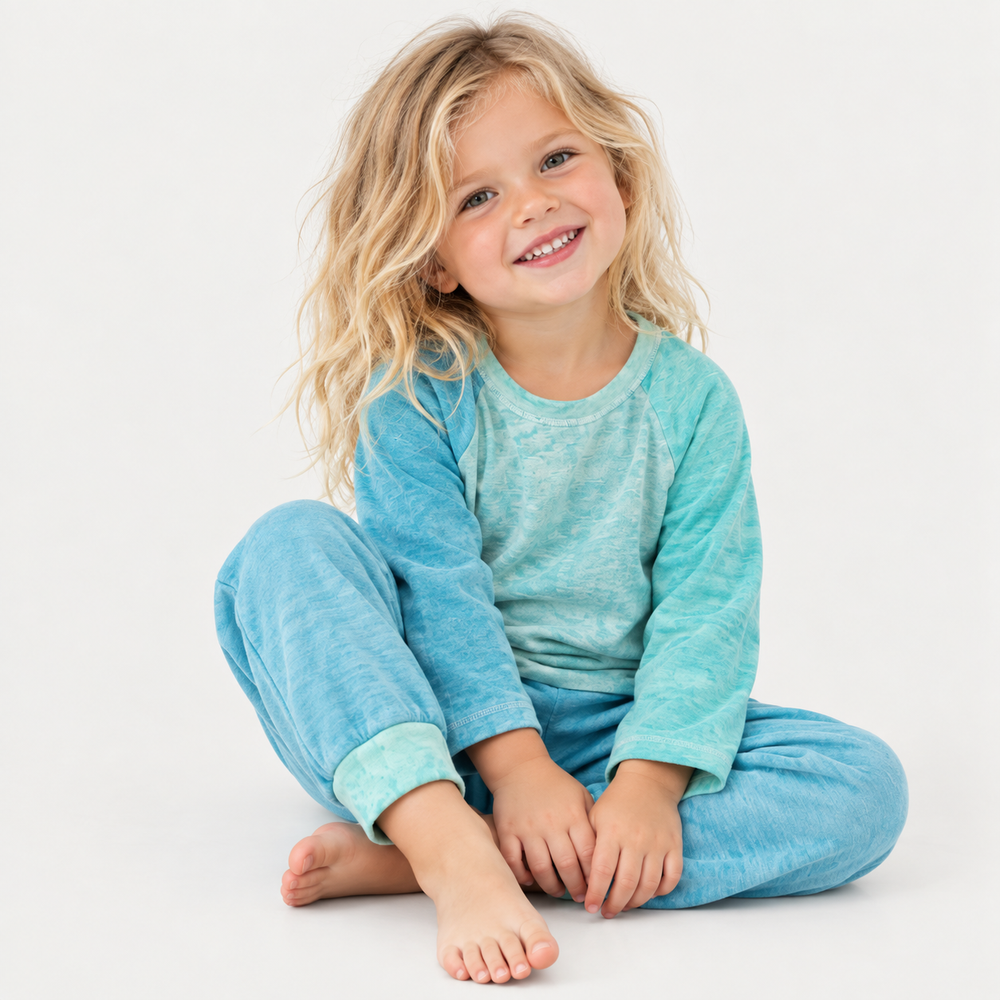Blonde child wearing PAIGELAUREN aqua marble slub rib tee and jogger set