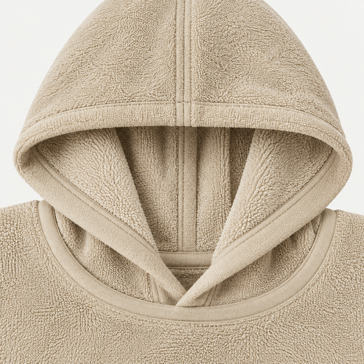 Beige loop terry hooded poncho neckline showing hood construction and textured fabric