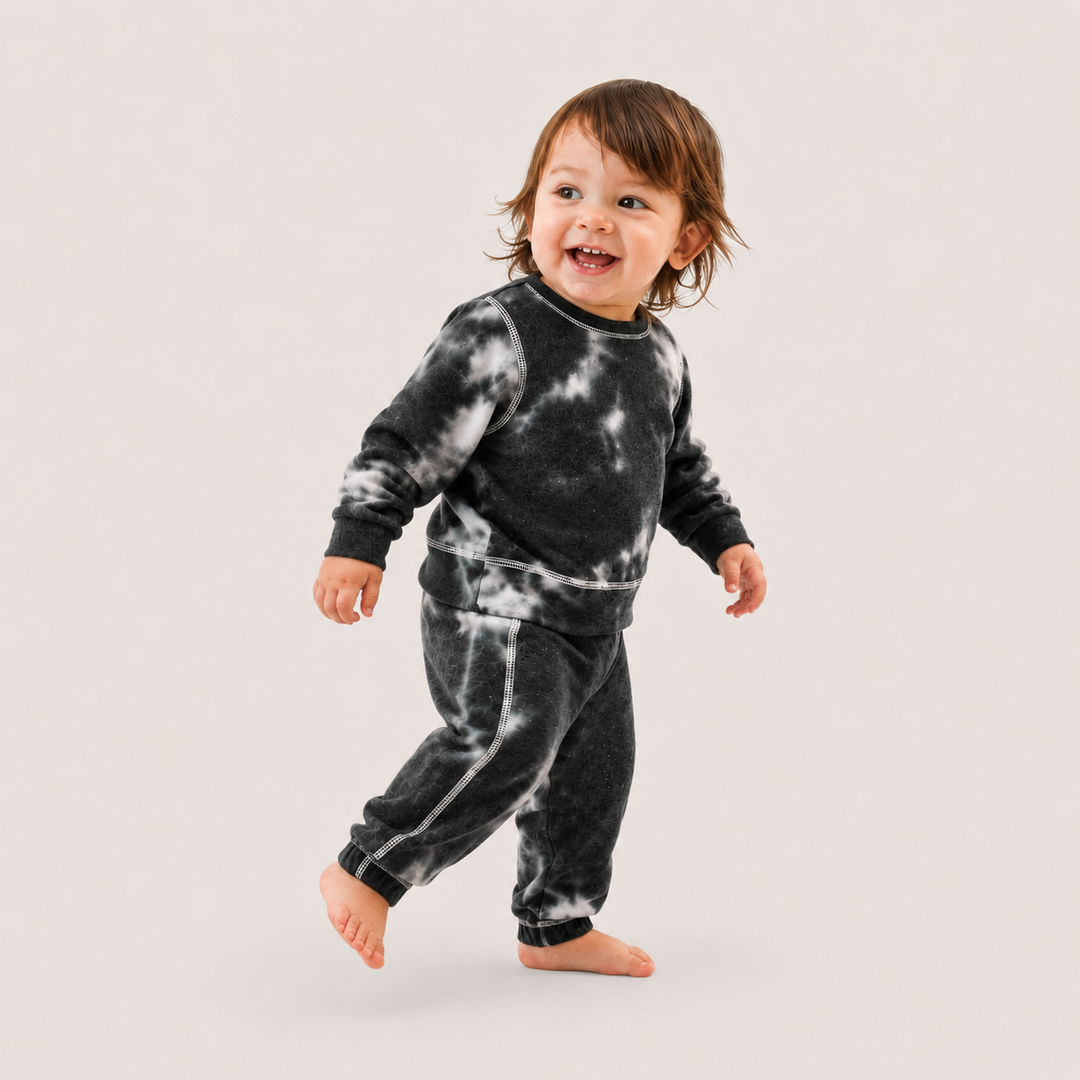 Baby wearing PAIGELAUREN Black Brushed Hacci Tie Dye Pullover and Pant Set