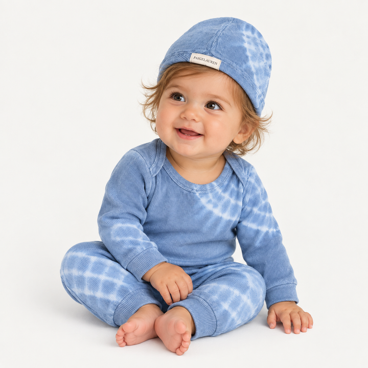 Baby wearing PAIGELAUREN Blue Blue Tie Dye Ribbed Beanie, Lap Tee and Legging Set