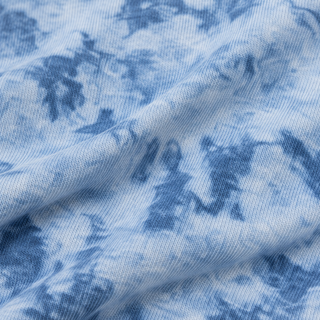 Close-up of PAIGELAUREN Blue Crystal Rib fabric and hand-dyed texture