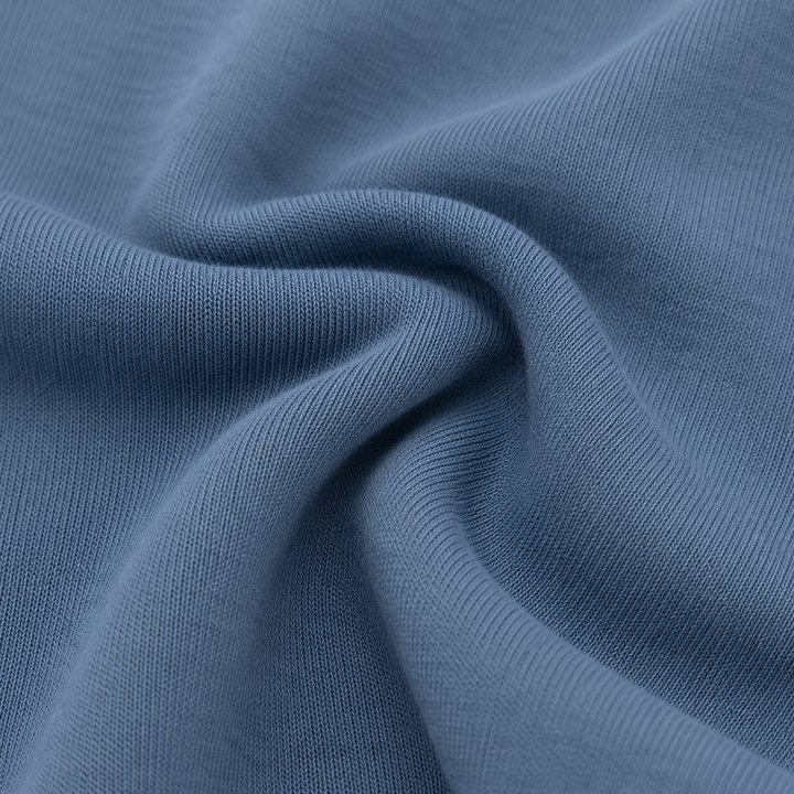 Close-up of soft PAIGELAUREN Blue Fleece fabric showing its cozy knit texture