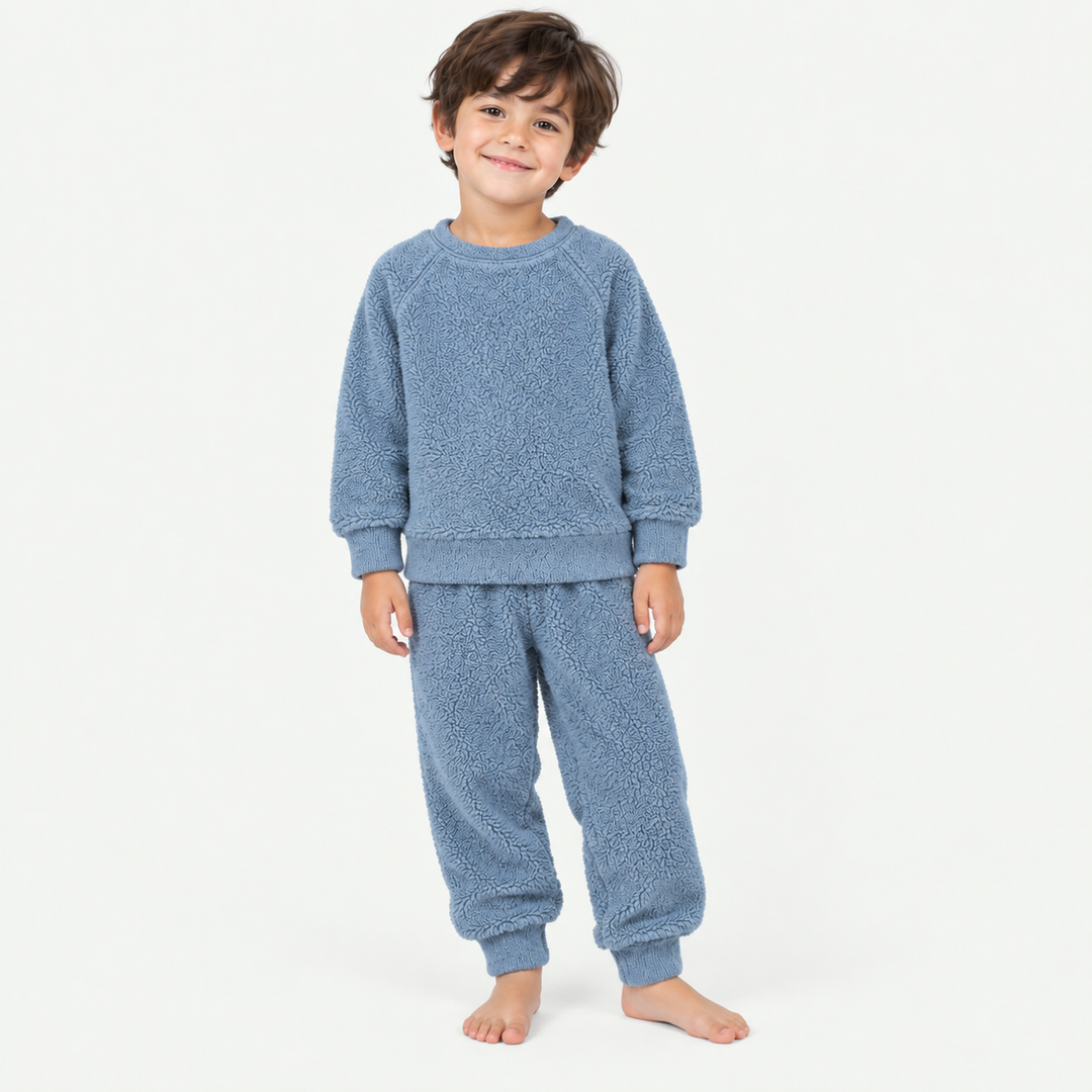 Boy wearing PAIGELAUREN Blue Fluffy Sherpa Sweatshirt and Jogger Set
