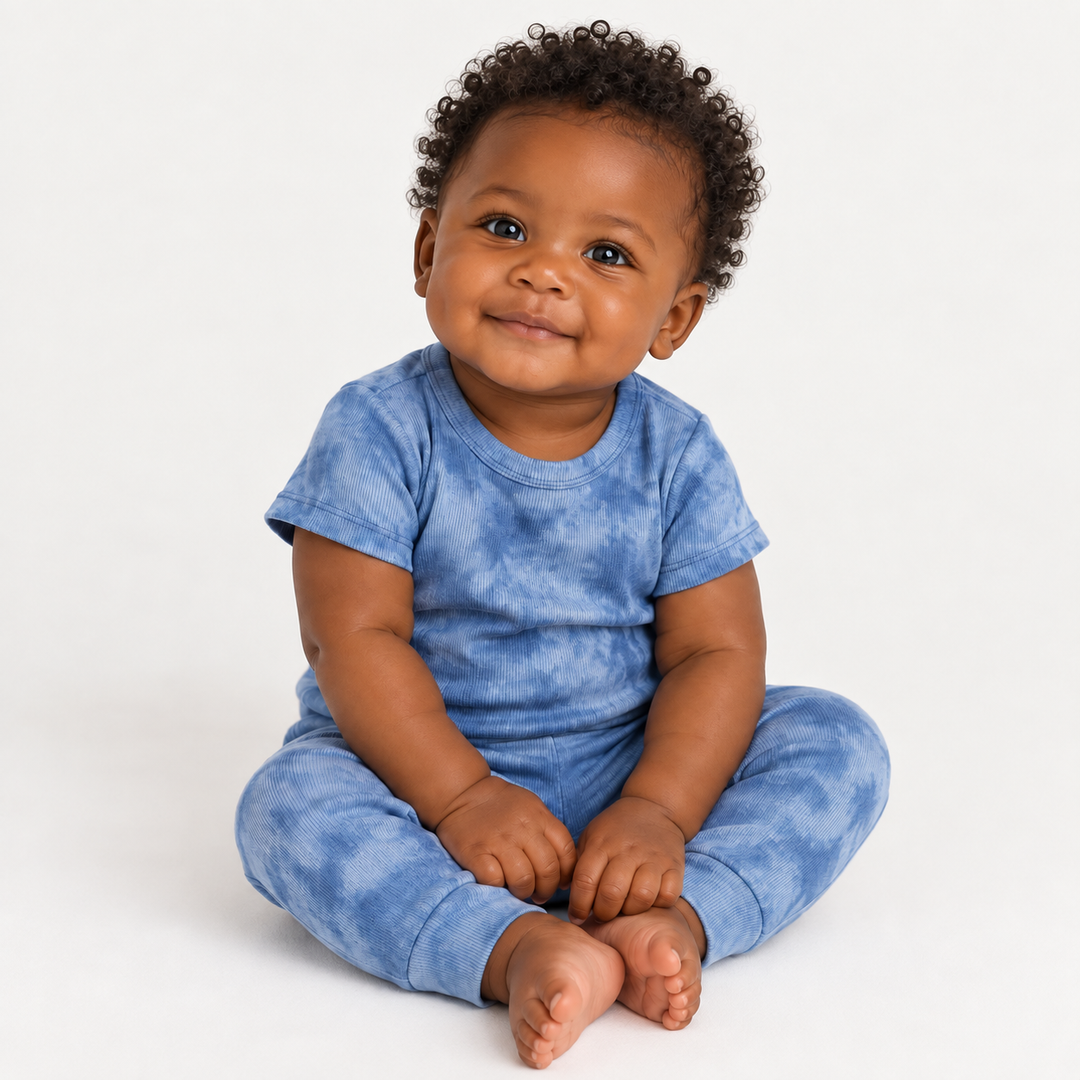 Baby wearing PAIGELAUREN Blue Marble 2x1 Rib Tee + Legging Set