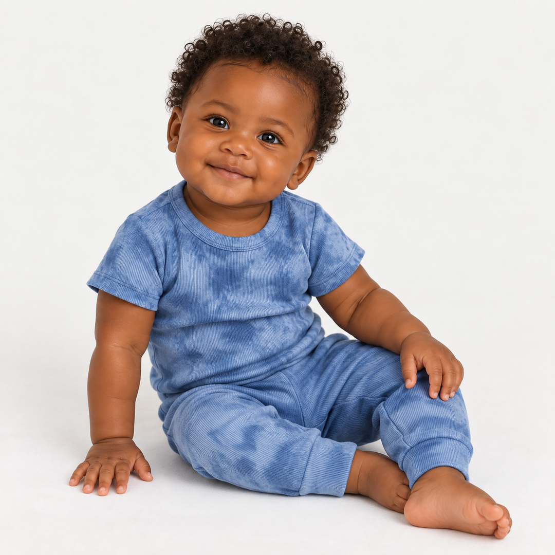 Baby seated in PAIGELAUREN Blue Marble 2x1 Rib Tee + Legging Set