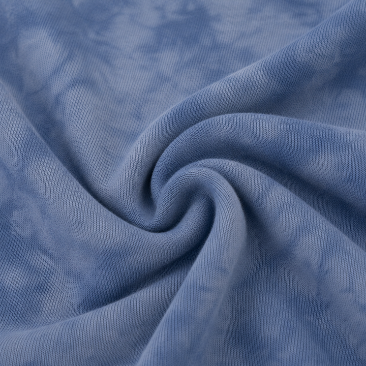 Close-up of soft fuzzy Blue Marble brushed hacci fabric and tonal marble dye
