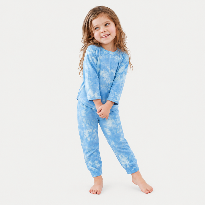 Child in blue marble French terry tee and jogger set by PAIGELAUREN