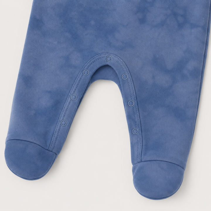 Inseam snap closure and built-in footie detail on Blue Marble Brushed Hacci Romper