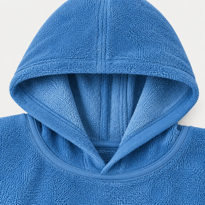 Blue ombré terry poncho hood and neckline with soft loop texture and finished seams