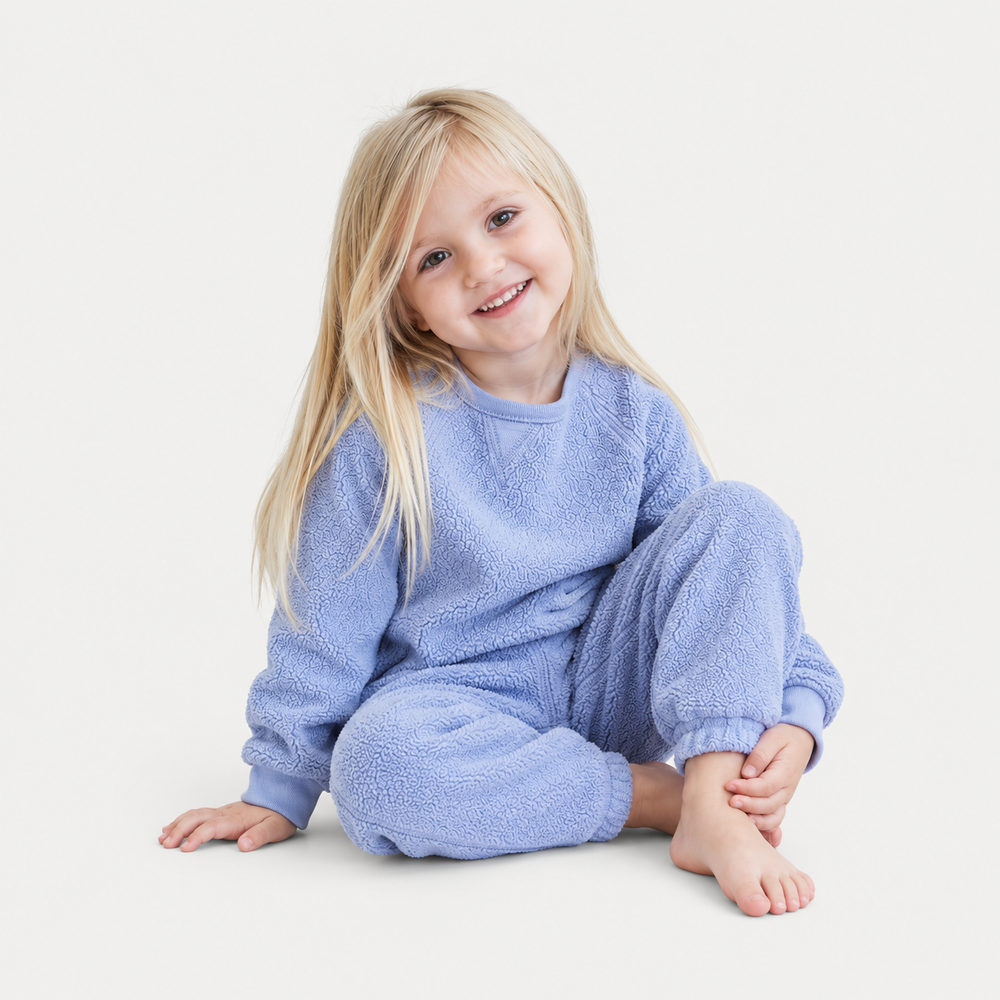 Toddler wearing PAIGELAUREN Blue Sherpa Sweatshirt and Sweatpant Set