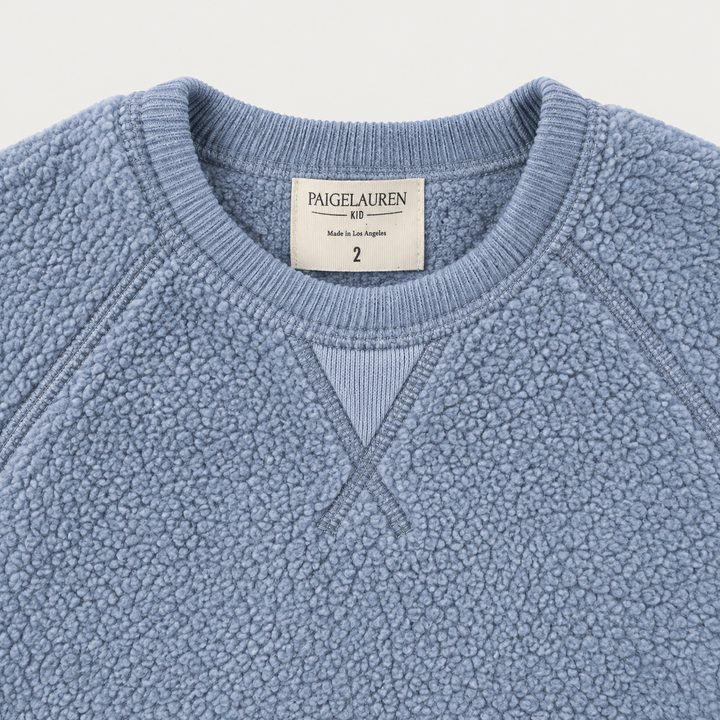 Blue Sherpa sweatshirt ribbed neckline, raglan seams and signature triangle detail