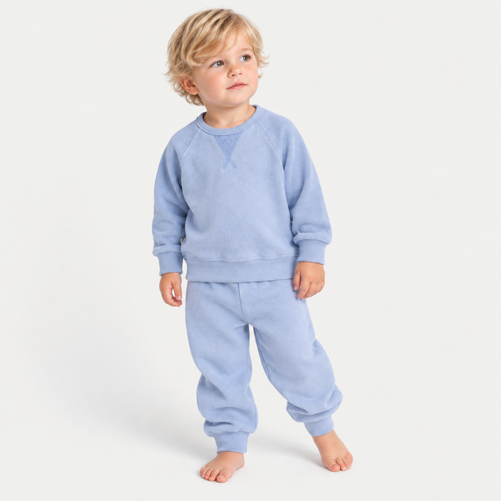 Toddler wearing PAIGELAUREN Blue Sherpa Raglan Sweatshirt and Jogger Set