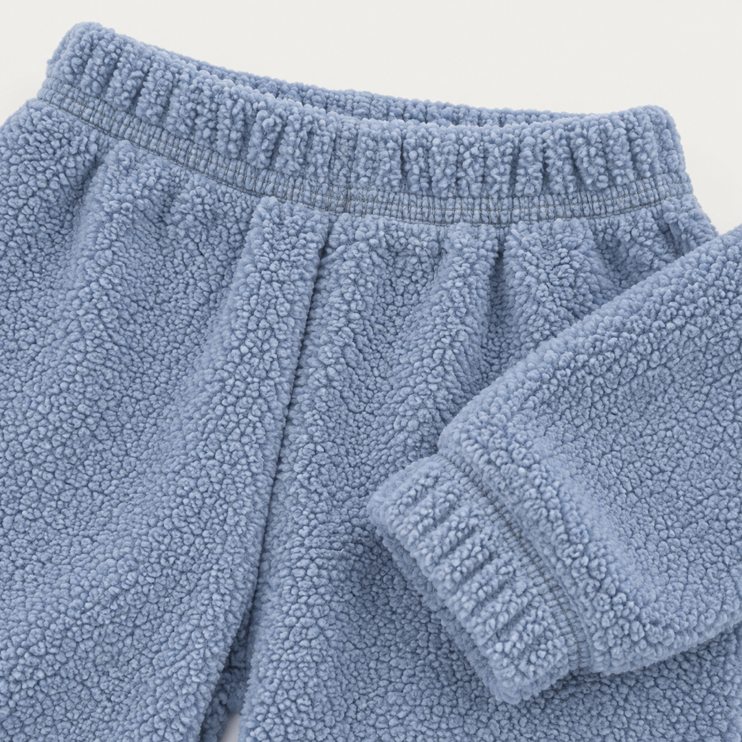 Blue Sherpa sweatpant elastic waistband, plush fabric and ribbed cuff detail