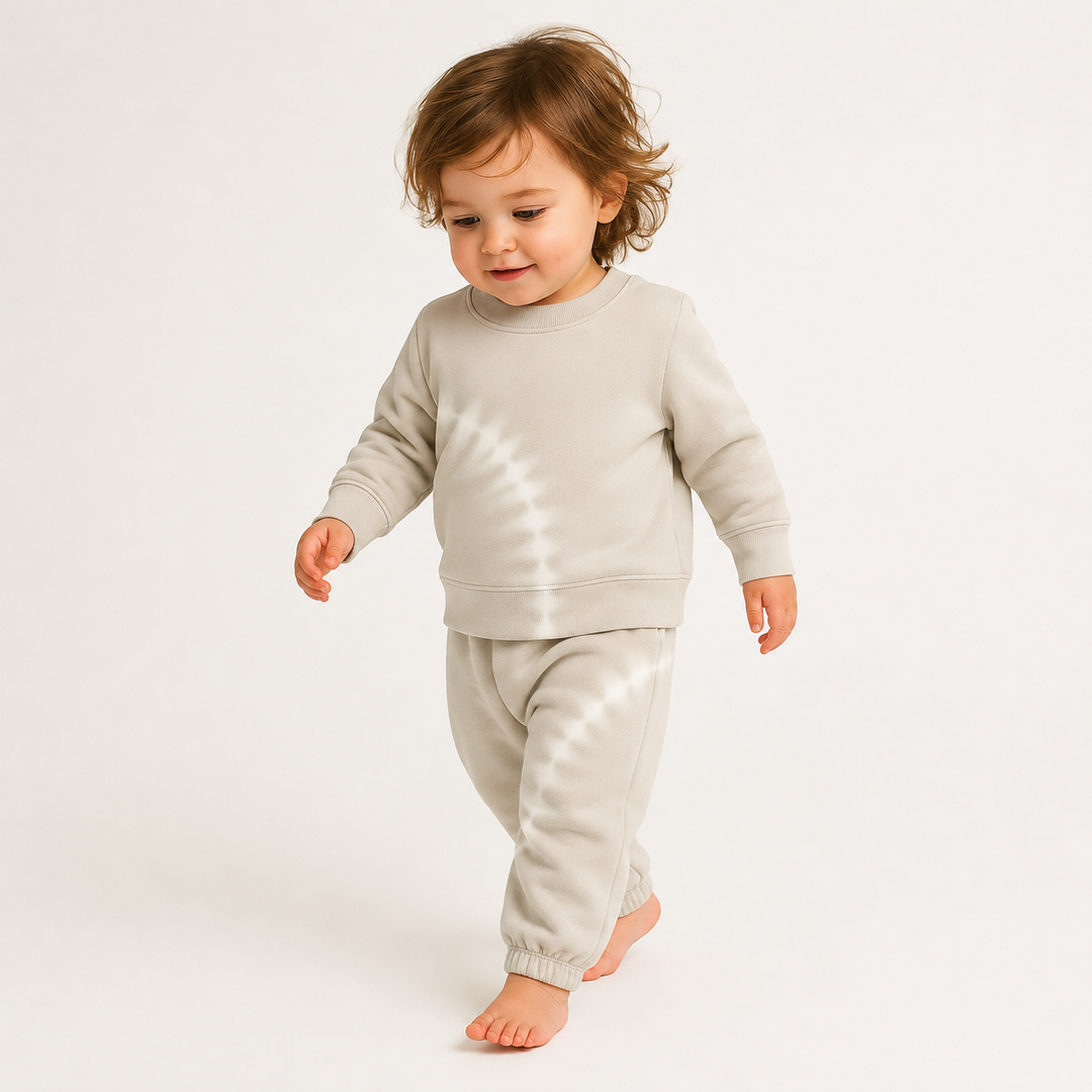 Baby wearing PAIGELAUREN Bone Tie Dye Fleece Sweatshirt and Sweatpant Set